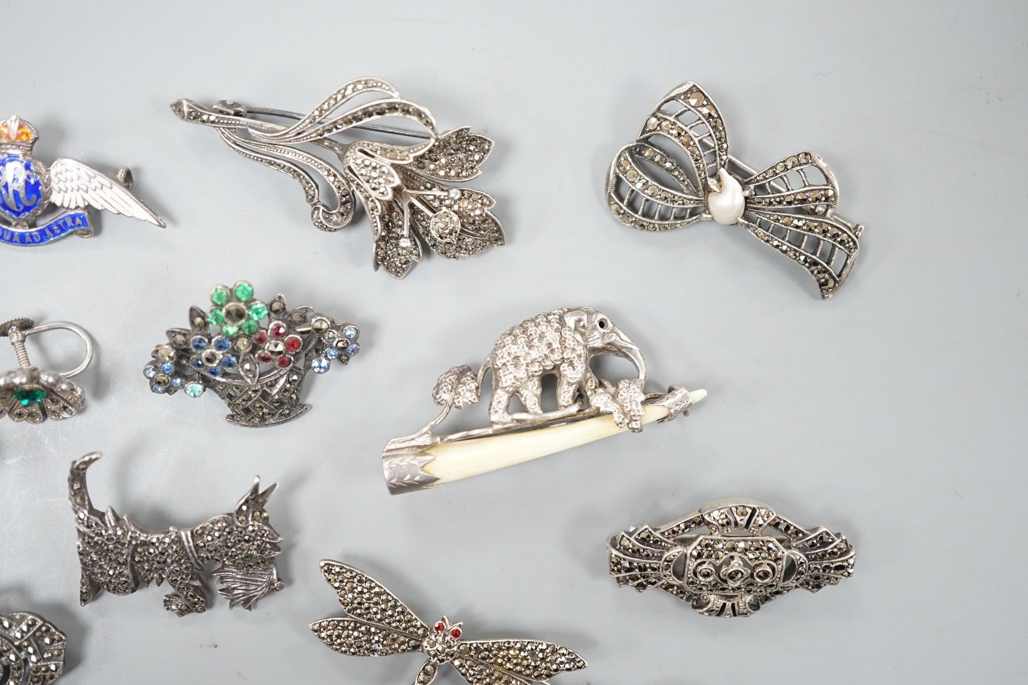 A small collection of assorted mainly white metal and marcasite set jewellery, including brooches, bracelet etc. and an enamelled RAF brooch.